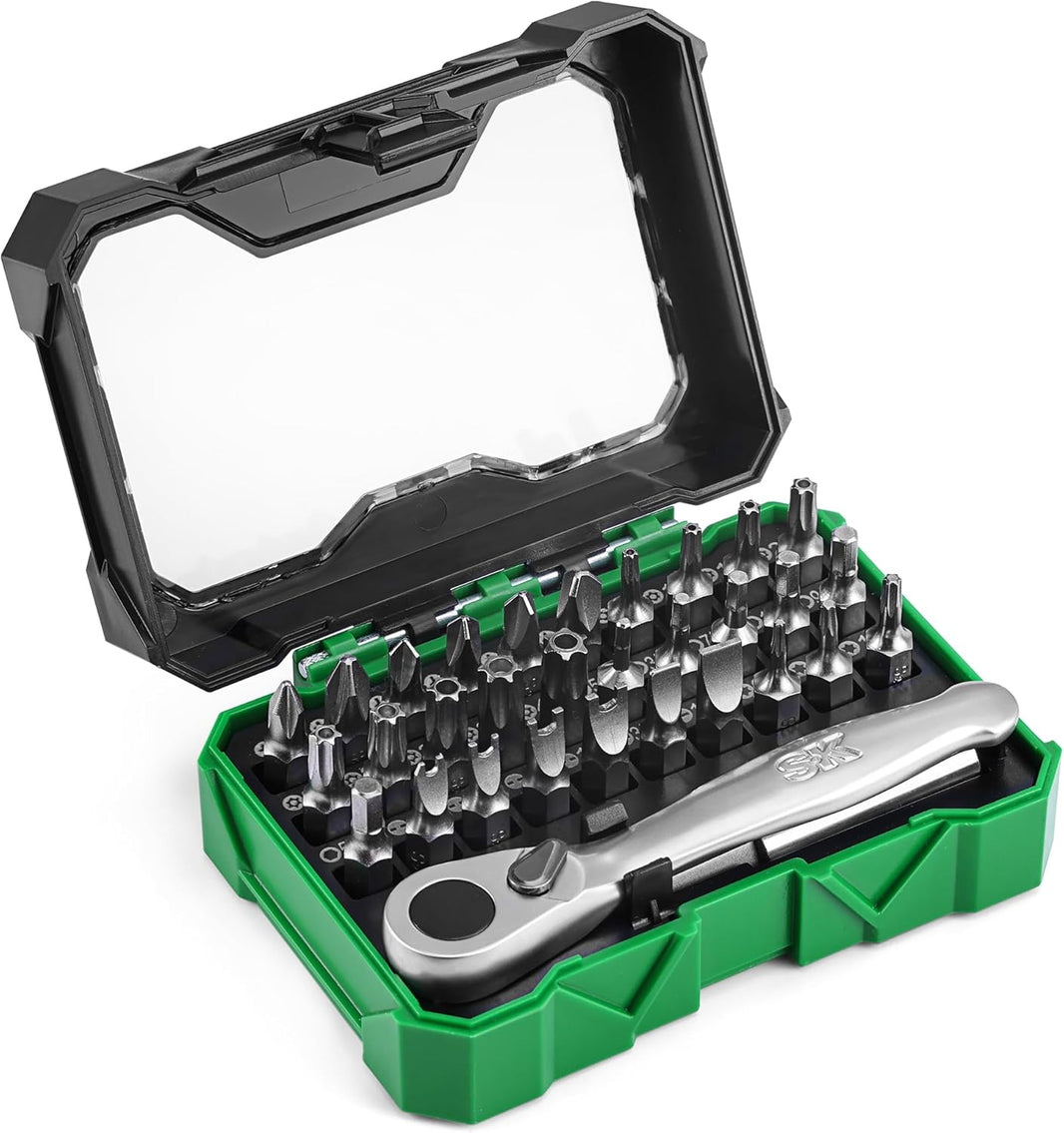 Set of screwdrivers and wrench in a green and black case on a white background
