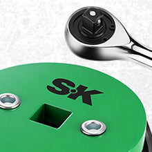 Green tool with S&K logo and a ratchet wrench on a textured background