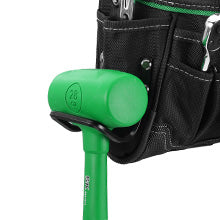 Green hammer with a black tool belt containing various tools on a white background