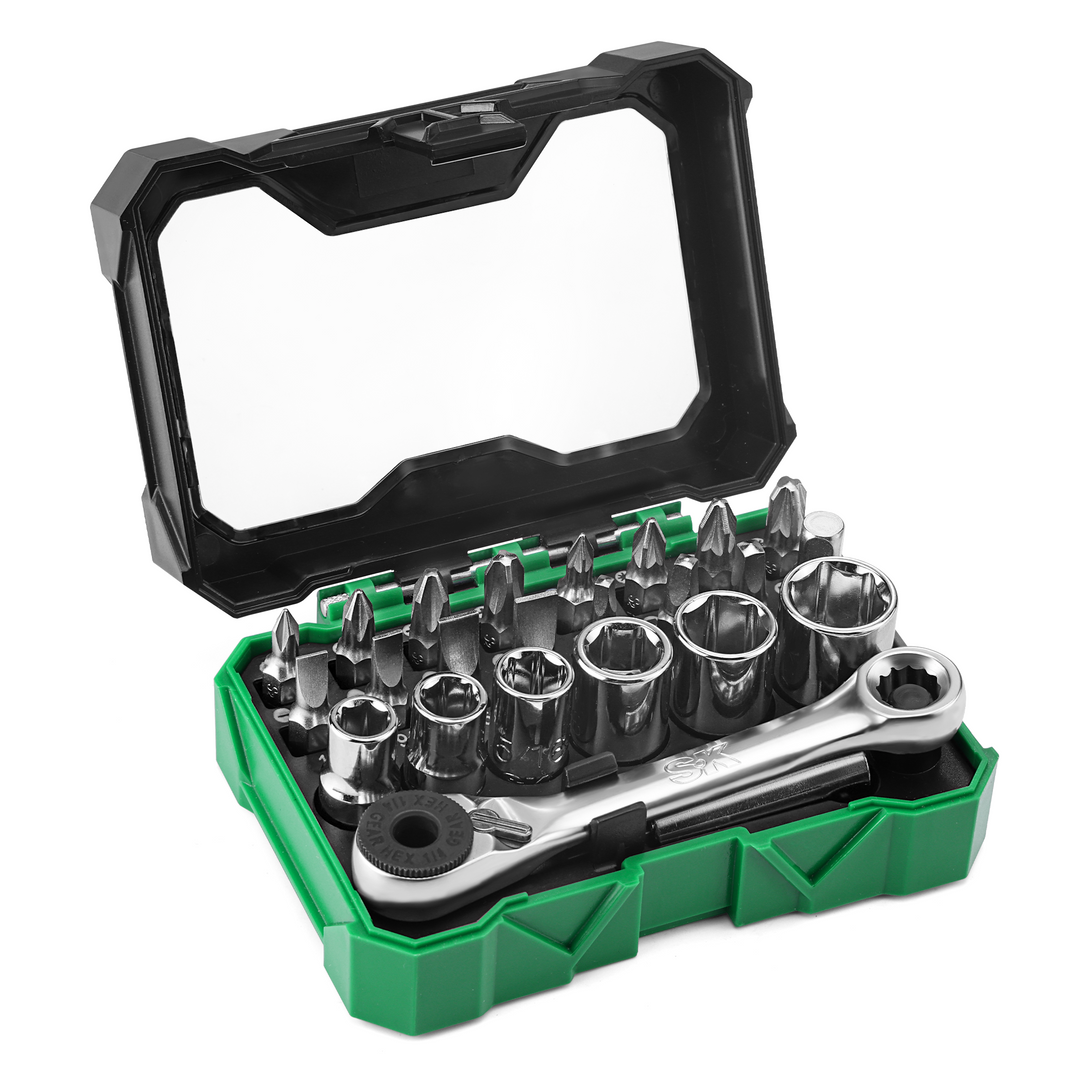 Tool set with bits and wrench in a green and black case on a white background